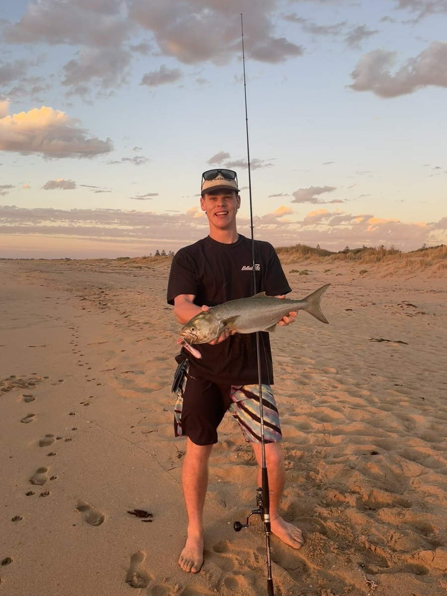 Beach fishing at sunset