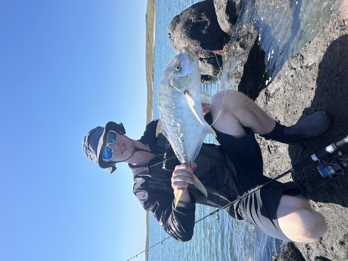 Golden trevally off the rocks