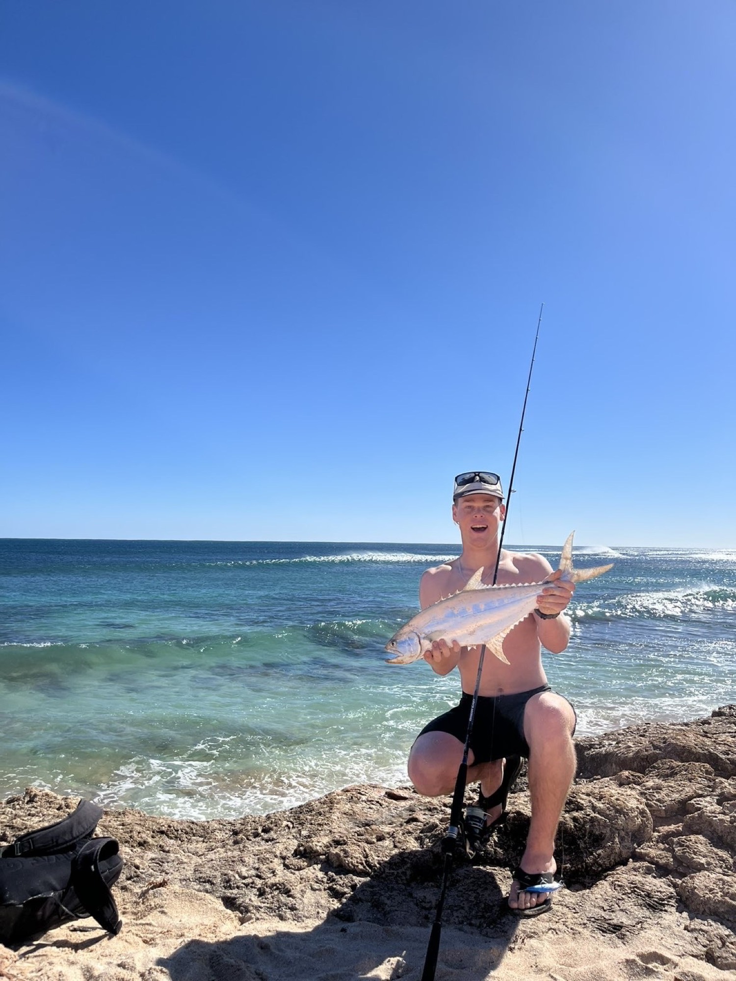 Beach fishing in clear WA water